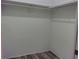 Spacious closet with double rods and wood-look flooring at 1848 Ridgewood St, Deland, FL 32720