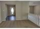 Bright entryway with an oval window door and wood-look floors at 1848 Ridgewood St, Deland, FL 32720