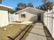 Side yard with a white picket fence and walkway to the back at 1848 Ridgewood St, Deland, FL 32720