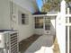 Side of the house with AC unit and a walkway to the back at 1848 Ridgewood St, Deland, FL 32720