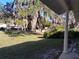 Front yard with grass, oak trees, and Spanish moss at 1848 Ridgewood St, Deland, FL 32720