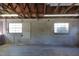 Garage with high ceiling, windows, and concrete floor at 1848 Ridgewood St, Deland, FL 32720