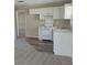Cozy kitchen with white cabinets and vinyl flooring at 1848 Ridgewood St, Deland, FL 32720