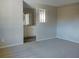 Living room with view of the bathroom and a half wall at 1848 Ridgewood St, Deland, FL 32720