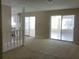 Open living area with access to a patio and kitchen at 1848 Ridgewood St, Deland, FL 32720