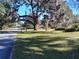 Street view showing a quiet neighborhood with mature trees at 1848 Ridgewood St, Deland, FL 32720