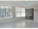 Bright sunroom with tile flooring and multiple windows at 1848 Ridgewood St, Deland, FL 32720