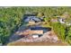 Aerial view showcasing a house, detached garage, and expansive backyard at 19160 Moorgate St, Orlando, FL 32833