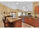 Granite kitchen island with seating and stainless steel appliances at 19160 Moorgate St, Orlando, FL 32833