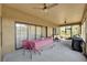 Relaxing screened porch with table, chairs, and grill at 19160 Moorgate St, Orlando, FL 32833