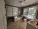 Clean bathroom with a bathtub, double vanity, and large windows at 1937 N Spring Garden Ave, Deland, FL 32720
