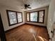 Bright bedroom with hardwood floors and large windows at 1937 N Spring Garden Ave, Deland, FL 32720