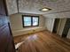 Cozy attic bedroom with hardwood floors and built-in shelving at 1937 N Spring Garden Ave, Deland, FL 32720