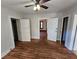 Spacious bedroom featuring hardwood floors and multiple entrances at 1937 N Spring Garden Ave, Deland, FL 32720