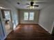 Bright bedroom with hardwood floors and ample closet space at 1937 N Spring Garden Ave, Deland, FL 32720