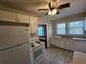 View of kitchen with white cabinets and appliances at 1937 N Spring Garden Ave, Deland, FL 32720