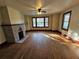 Living room featuring hardwood floors and a brick fireplace at 1937 N Spring Garden Ave, Deland, FL 32720
