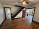 Spacious living area with hardwood floors and staircase at 1937 N Spring Garden Ave, Deland, FL 32720
