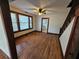 Living room with hardwood floors, fireplace, and large windows at 1937 N Spring Garden Ave, Deland, FL 32720