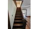 Classic wooden staircase leading to the second floor at 1937 N Spring Garden Ave, Deland, FL 32720