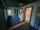Screened porch with view of backyard and access to kitchen at 1937 N Spring Garden Ave, Deland, FL 32720