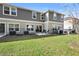 Spacious backyard with grassy area and a patio at 2353 Carrabelle Way, Sanford, FL 32771