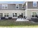 Small paved patio and grassy backyard with AC units at 2353 Carrabelle Way, Sanford, FL 32771