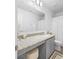 Updated bathroom features granite countertops and gray vanity at 2353 Carrabelle Way, Sanford, FL 32771