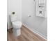 Clean and simple bathroom with toilet and wood-look flooring at 2353 Carrabelle Way, Sanford, FL 32771