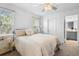 Bright bedroom with a queen bed and en-suite bathroom at 2353 Carrabelle Way, Sanford, FL 32771