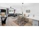Elegant dining area with glass-top table and four chairs at 2353 Carrabelle Way, Sanford, FL 32771