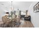 Elegant dining room with glass table and modern chairs at 2353 Carrabelle Way, Sanford, FL 32771
