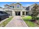 Beautiful townhome with attached garage, paver driveway, and easy access to the front door at 2353 Carrabelle Way, Sanford, FL 32771