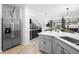 Stainless steel refrigerator and kitchen island with white countertop at 2353 Carrabelle Way, Sanford, FL 32771
