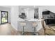 Modern kitchen with white cabinets and stainless steel appliances at 2353 Carrabelle Way, Sanford, FL 32771