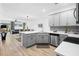 Modern kitchen with gray cabinets, quartz countertops, and stainless steel appliances at 2353 Carrabelle Way, Sanford, FL 32771