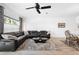 Living room featuring a sectional sofa and a large area rug at 2353 Carrabelle Way, Sanford, FL 32771