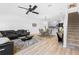 Open living area with stylish furniture and hardwood floors at 2353 Carrabelle Way, Sanford, FL 32771