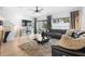 Spacious living room featuring a modern sectional sofa and large TV at 2353 Carrabelle Way, Sanford, FL 32771
