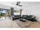 Spacious living room with sectional sofa and large windows at 2353 Carrabelle Way, Sanford, FL 32771