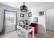 Home office with white desk and comfortable red chair at 2353 Carrabelle Way, Sanford, FL 32771