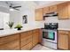 Modern kitchen with stainless steel appliances and wood cabinets at 24 Cedar Dunes Dr, New Smyrna Beach, FL 32169