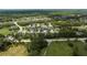 Aerial view of a community with numerous houses and lush green surroundings at 2423 Wild Turkey Creek Ln, Port Orange, FL 32128