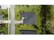Overhead view of a single-Gathering home with a dark roof and a paved driveway at 2423 Wild Turkey Creek Ln, Port Orange, FL 32128