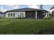 House with a large backyard and screened patio at 2423 Wild Turkey Creek Ln, Port Orange, FL 32128