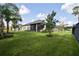 Home with a large backyard and screened porch at 2423 Wild Turkey Creek Ln, Port Orange, FL 32128