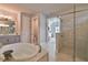 Spa-like bathroom with a soaking tub, walk-in shower, and separate toilet at 2423 Wild Turkey Creek Ln, Port Orange, FL 32128