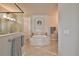 Luxurious bathroom with a large soaking tub, walk-in shower, and double vanity at 2423 Wild Turkey Creek Ln, Port Orange, FL 32128