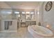 Elegant bathroom with a large soaking tub, walk-in shower, and double vanity at 2423 Wild Turkey Creek Ln, Port Orange, FL 32128