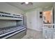 bedroom with a bunk bed and plenty of room to play at 2423 Wild Turkey Creek Ln, Port Orange, FL 32128